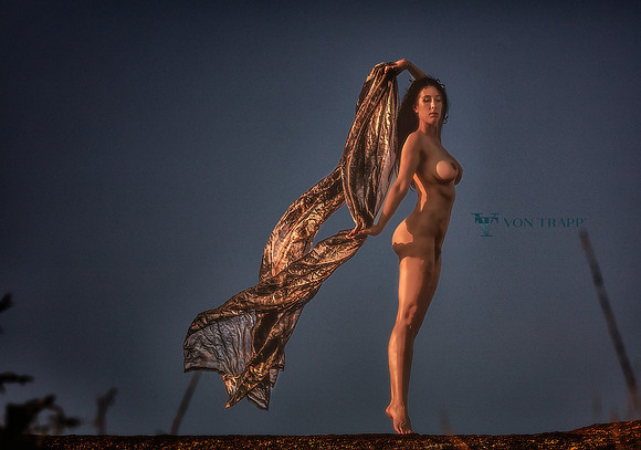 Art nude photo of a woman in the Texas hill country atop a granite mountain.