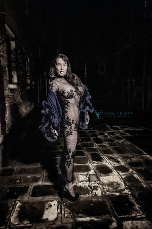 Glamour photo of a woman outdoors at night in Venice.