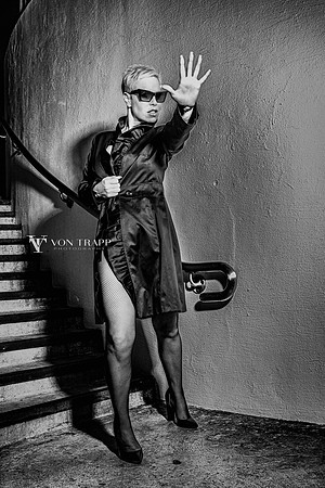 Edgy fashion photograph of a hot dive interacting with a paparazzi.