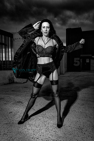 Glamour boudoir photo of a woman in sexy lingerie outdoors in a parking garage in San Antonio.